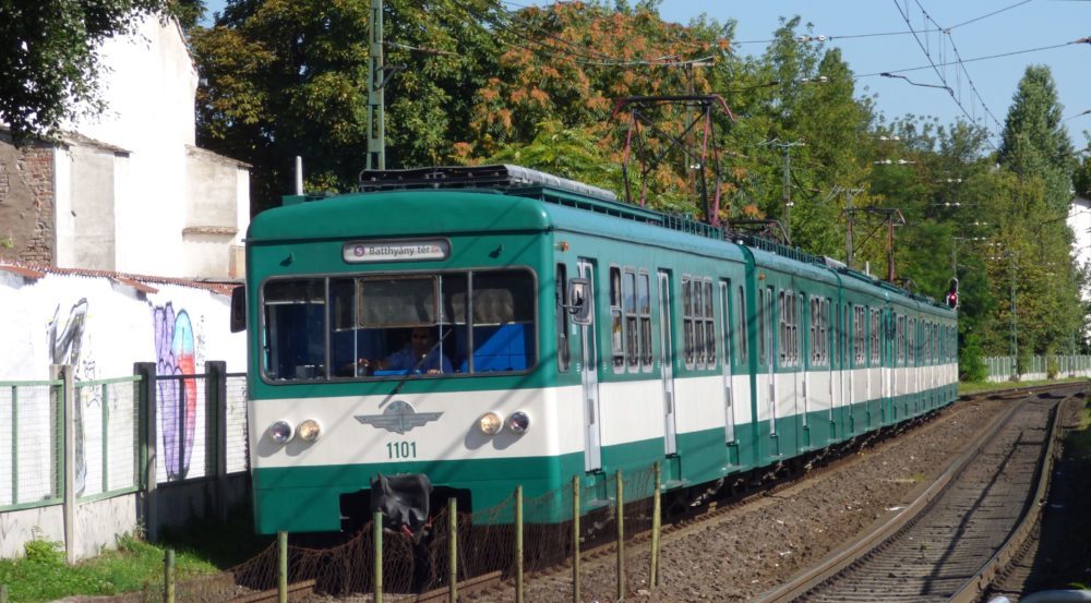 green hev train on tracks